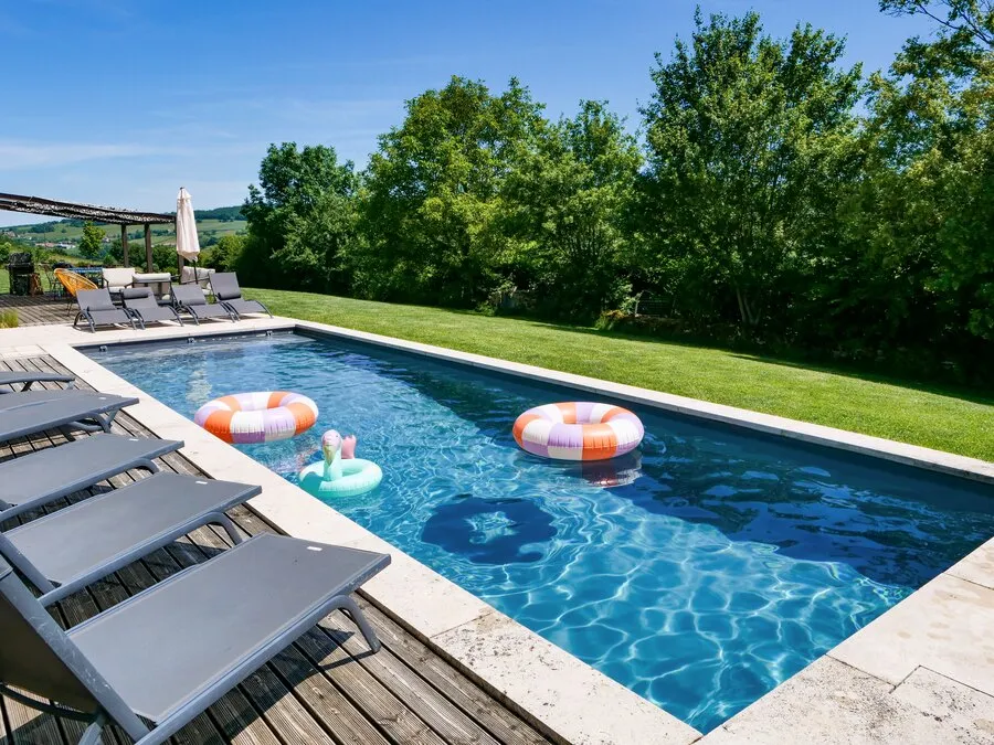 The pool with its sun loungers and pool floats